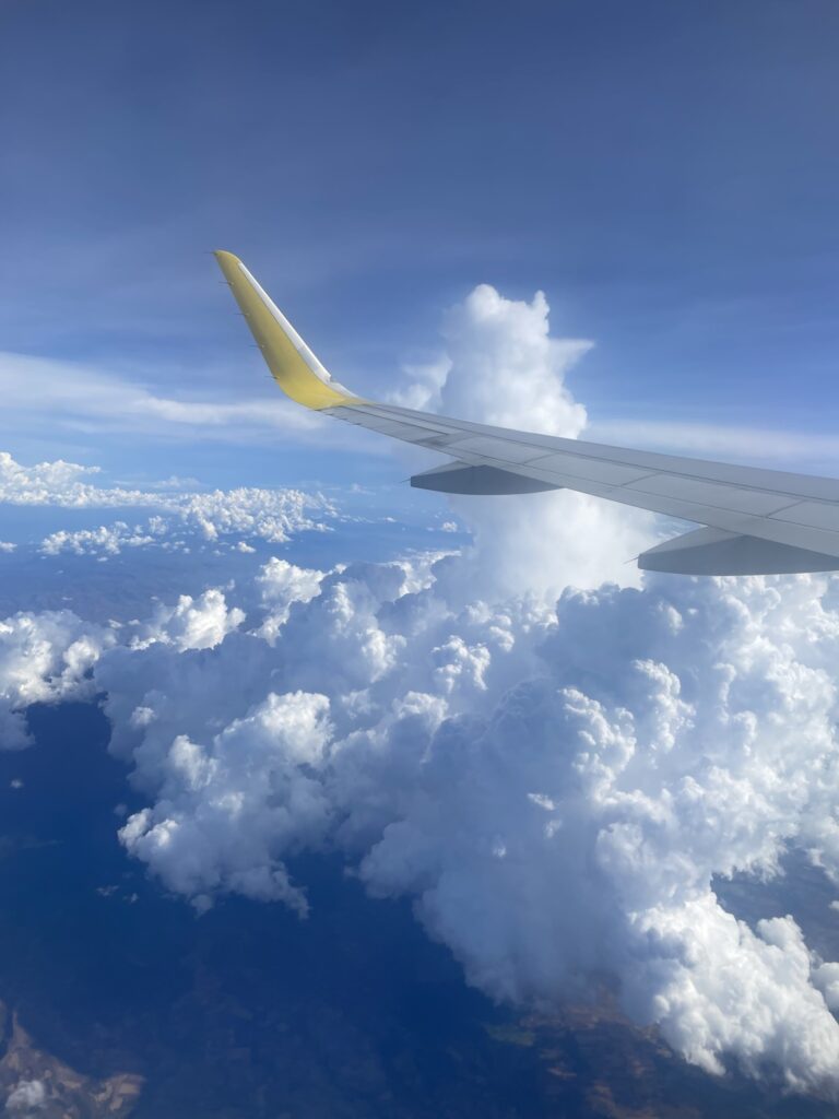 window seat view in the airplane-a view with sea of clouds